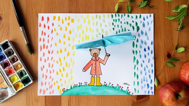 Bär mit einem Regenschirm unter den bunten Regentropfen